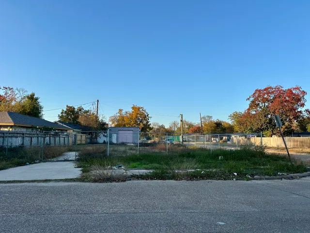 a view of a street with a park