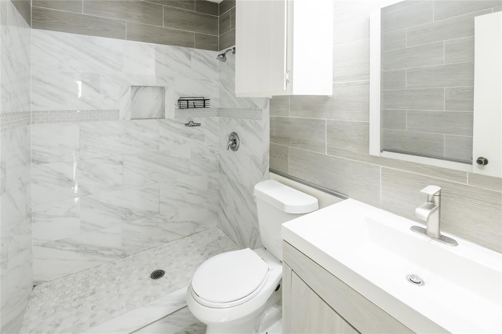 7324 Hyde Court Fort Worth, TX 76112 - Photo 15 of 20 a bathroom with a sink a toilet and shower