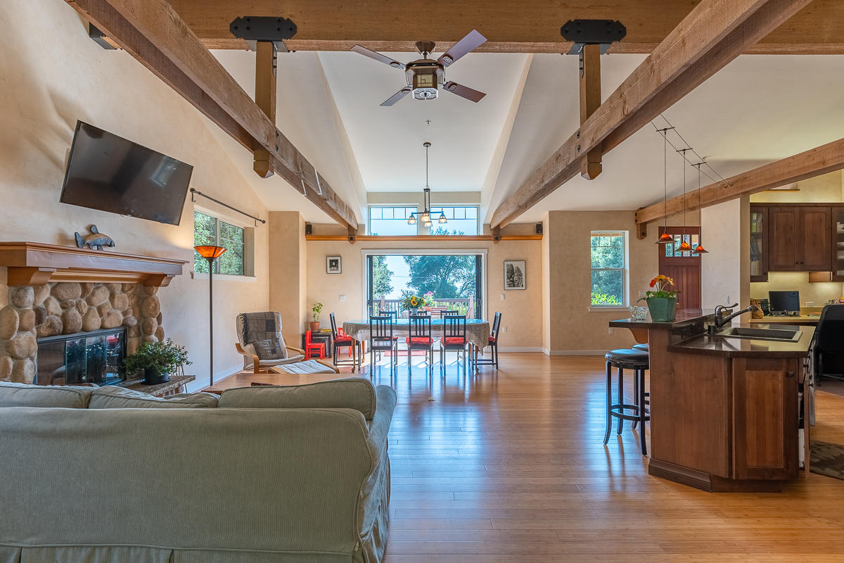 7 North San Marcos Road Santa Barbara, CA 93111 - Photo 12 of 43 a living room with furniture dining table a flat screen tv and windows