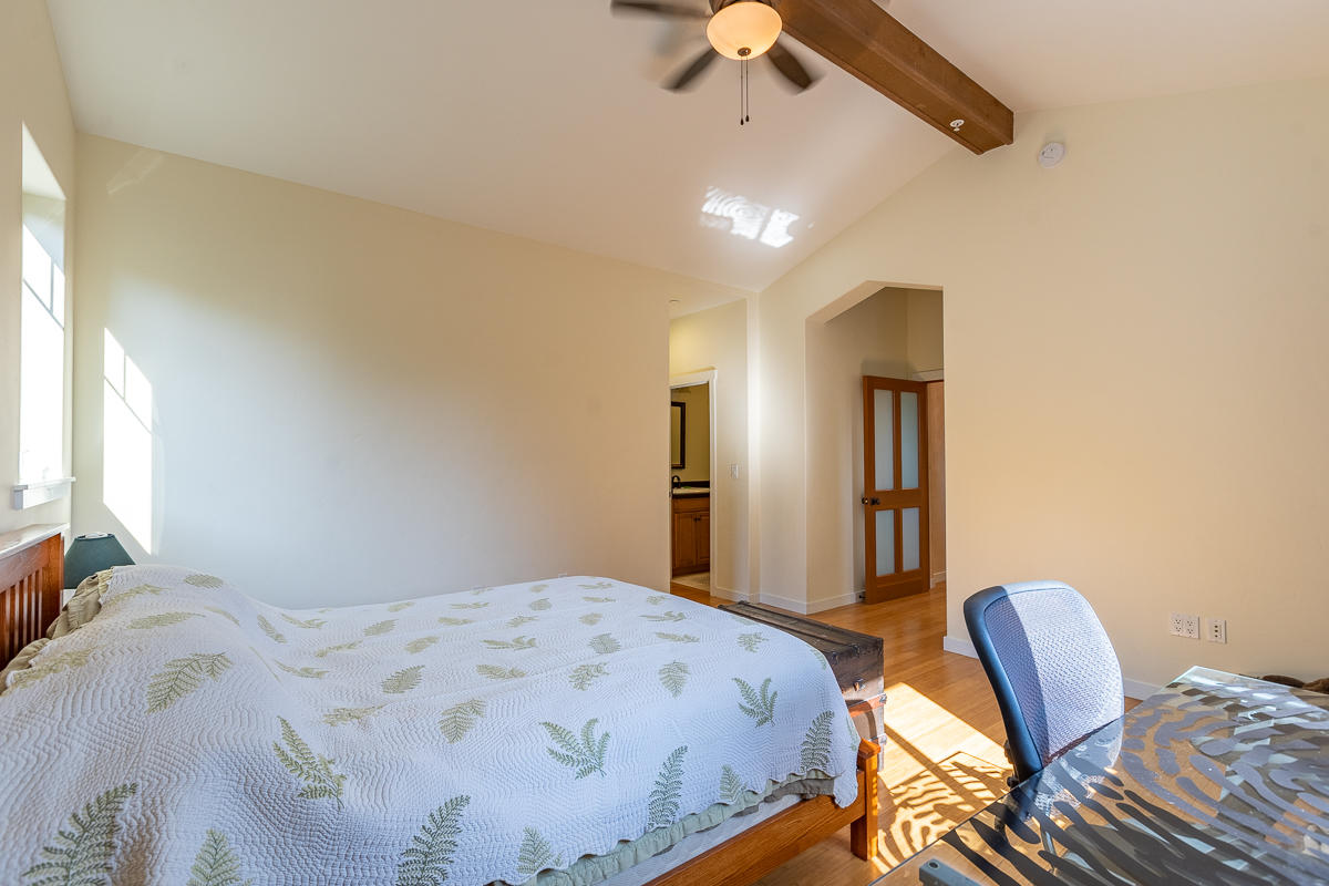 7 North San Marcos Road Santa Barbara, CA 93111 - Photo 21 of 43 a bedroom with a bed a chair and the dresser