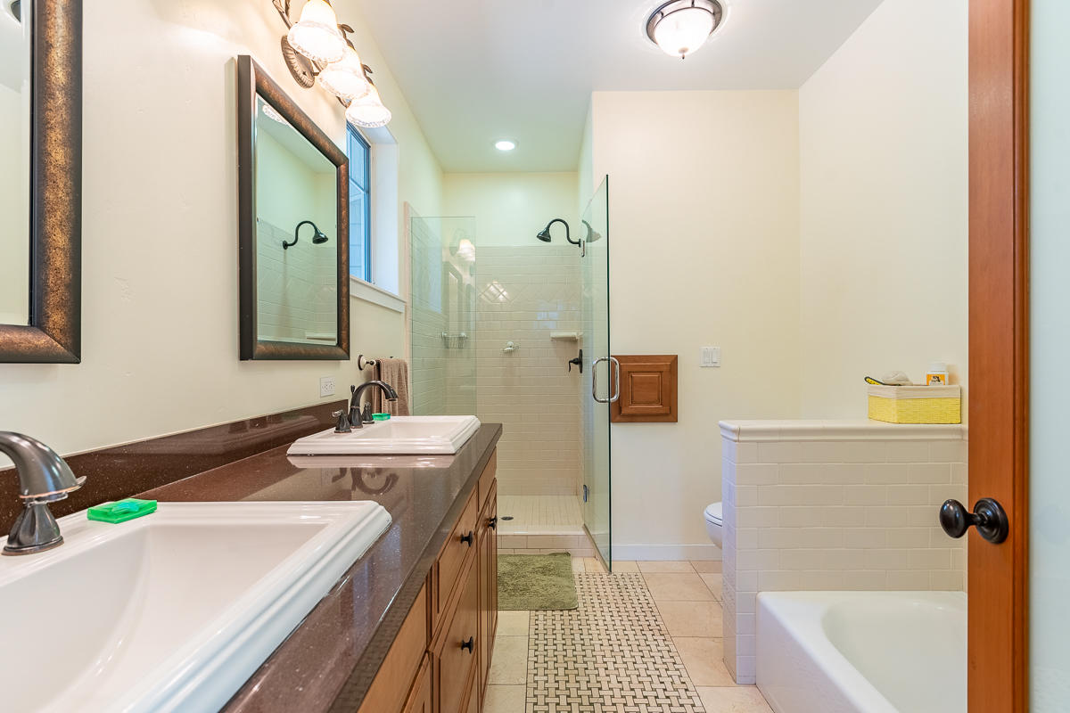 7 North San Marcos Road Santa Barbara, CA 93111 - Photo 23 of 43 a bathroom with a tub sink and mirror