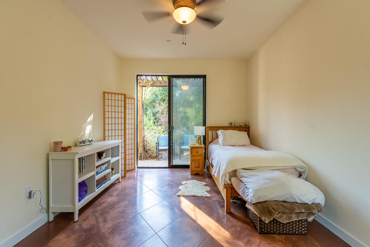 7 North San Marcos Road Santa Barbara, CA 93111 - Photo 24 of 43 a living room with a bed furniture and a large window