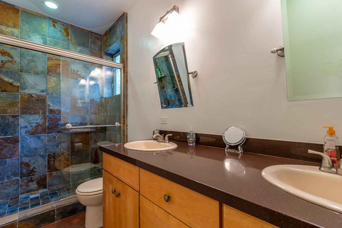 7 North San Marcos Road Santa Barbara, CA 93111 - Photo 27 of 43 a bathroom with a double vanity sink mirror and toilet