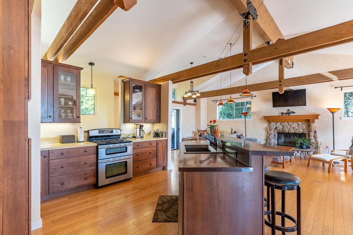 7 North San Marcos Road Santa Barbara, CA 93111 - Photo 4 of 43 a kitchen with stainless steel appliances kitchen island granite countertop a stove and cabinets