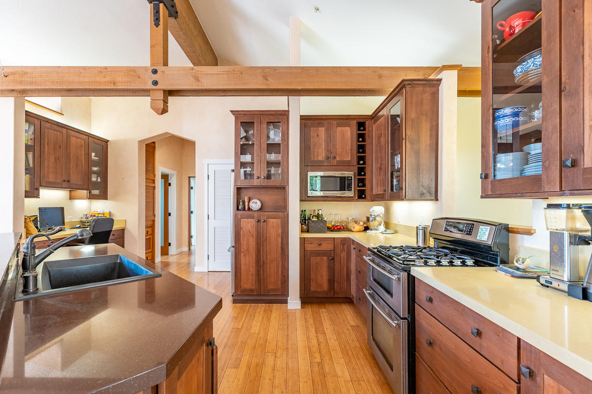 7 North San Marcos Road Santa Barbara, CA 93111 - Photo 6 of 43 a kitchen with stainless steel appliances granite countertop a sink stove and cabinets