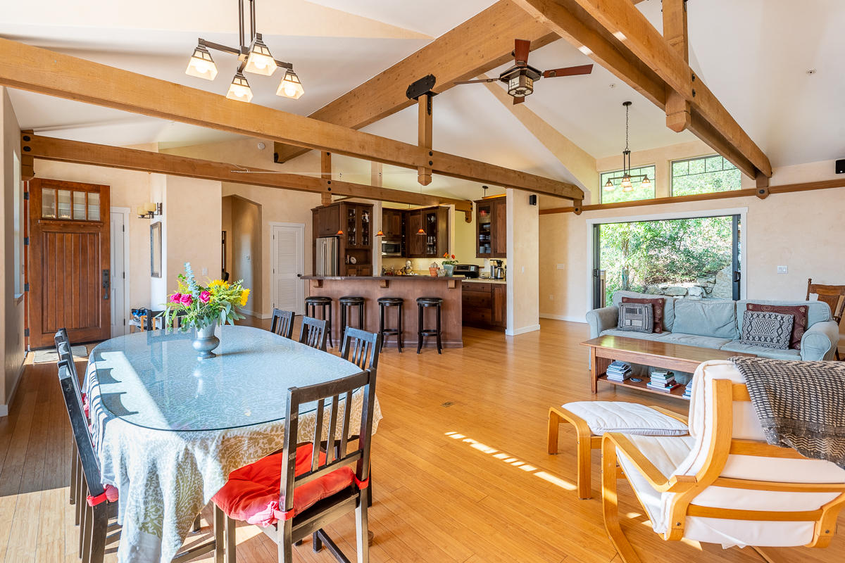7 North San Marcos Road Santa Barbara, CA 93111 - Photo 10 of 43 a dining room with wooden floor a chandelier a glass table and chairs