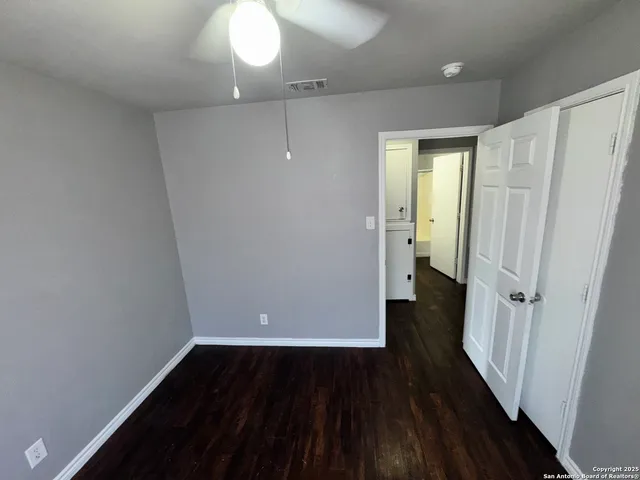wooden floor in an empty room with a gallery