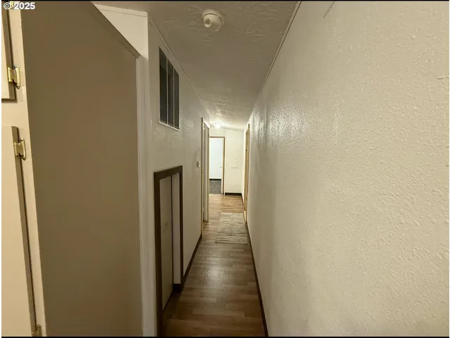 a bathroom with a shower and a sink