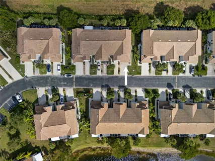 an aerial view of houses with outdoor space