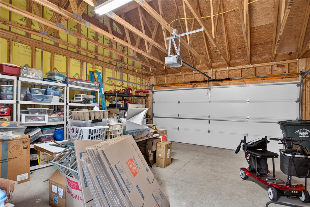 112 Tuttle Street Clemson, SC 29631 - Photo 27 of 46 A spacious garage offering ample storage and easy access with an automatic door opener.