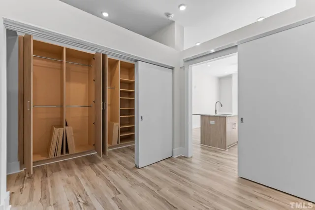 a view of wooden floor and windows in a room
