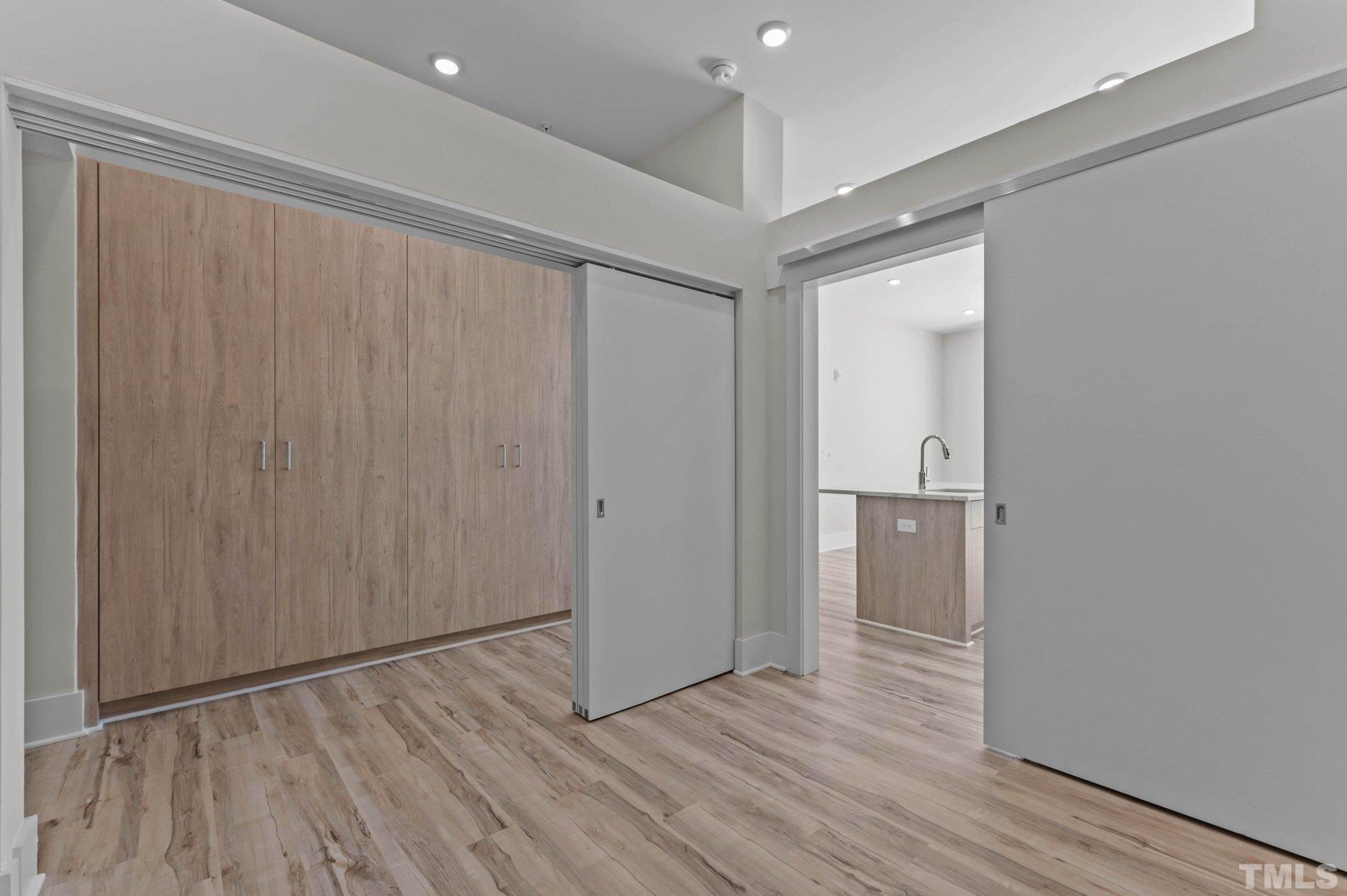 2441 Campus Shore Drive, Unit 309 Raleigh, NC 27606 - Photo 14 of 49 a view of hallway with wooden floor