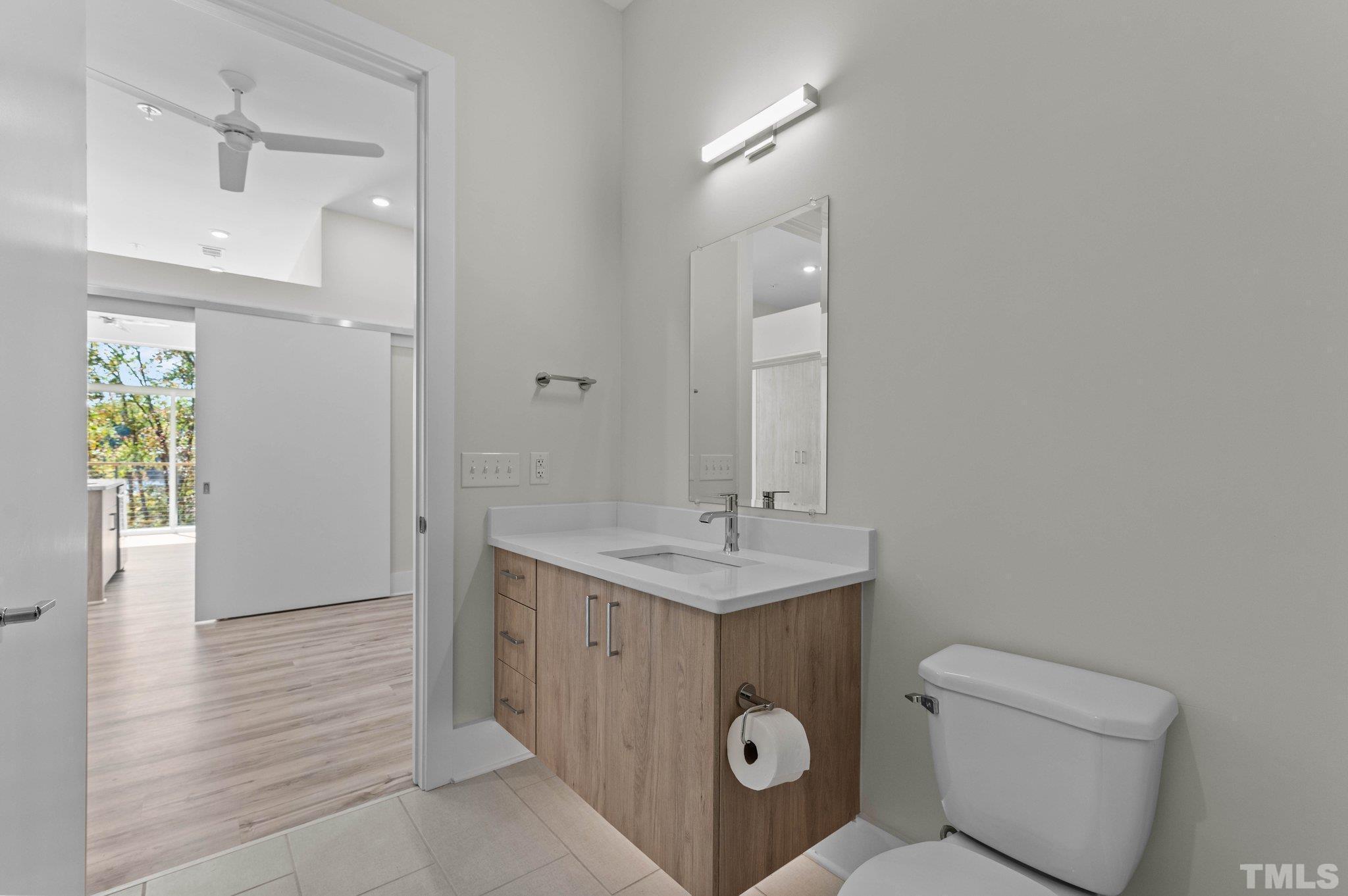 2441 Campus Shore Drive, Unit 309 Raleigh, NC 27606 - Photo 15 of 49 a bathroom with a sink toilet and shower