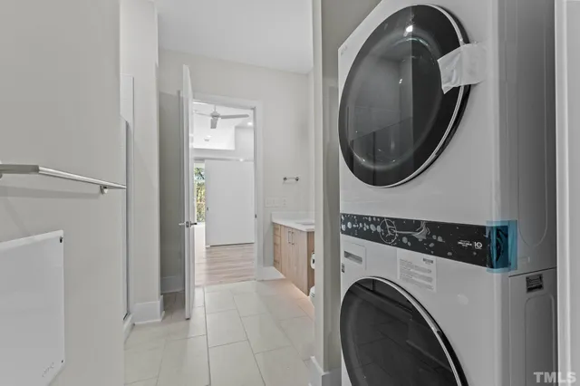 a view of a small space with wooden floor and a window