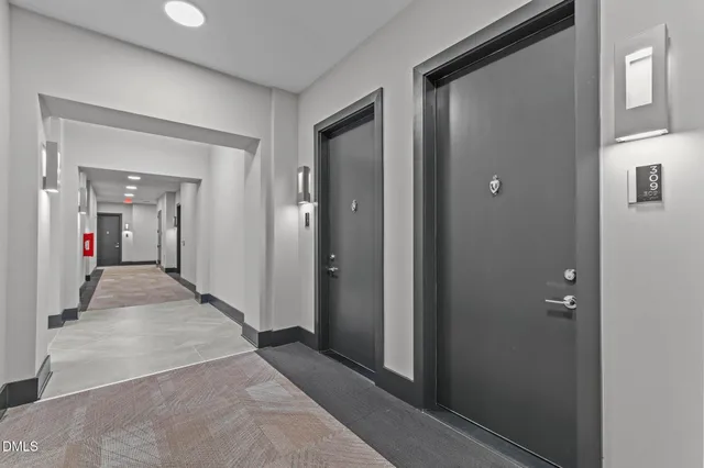a view of a lobby with furniture and wooden floor