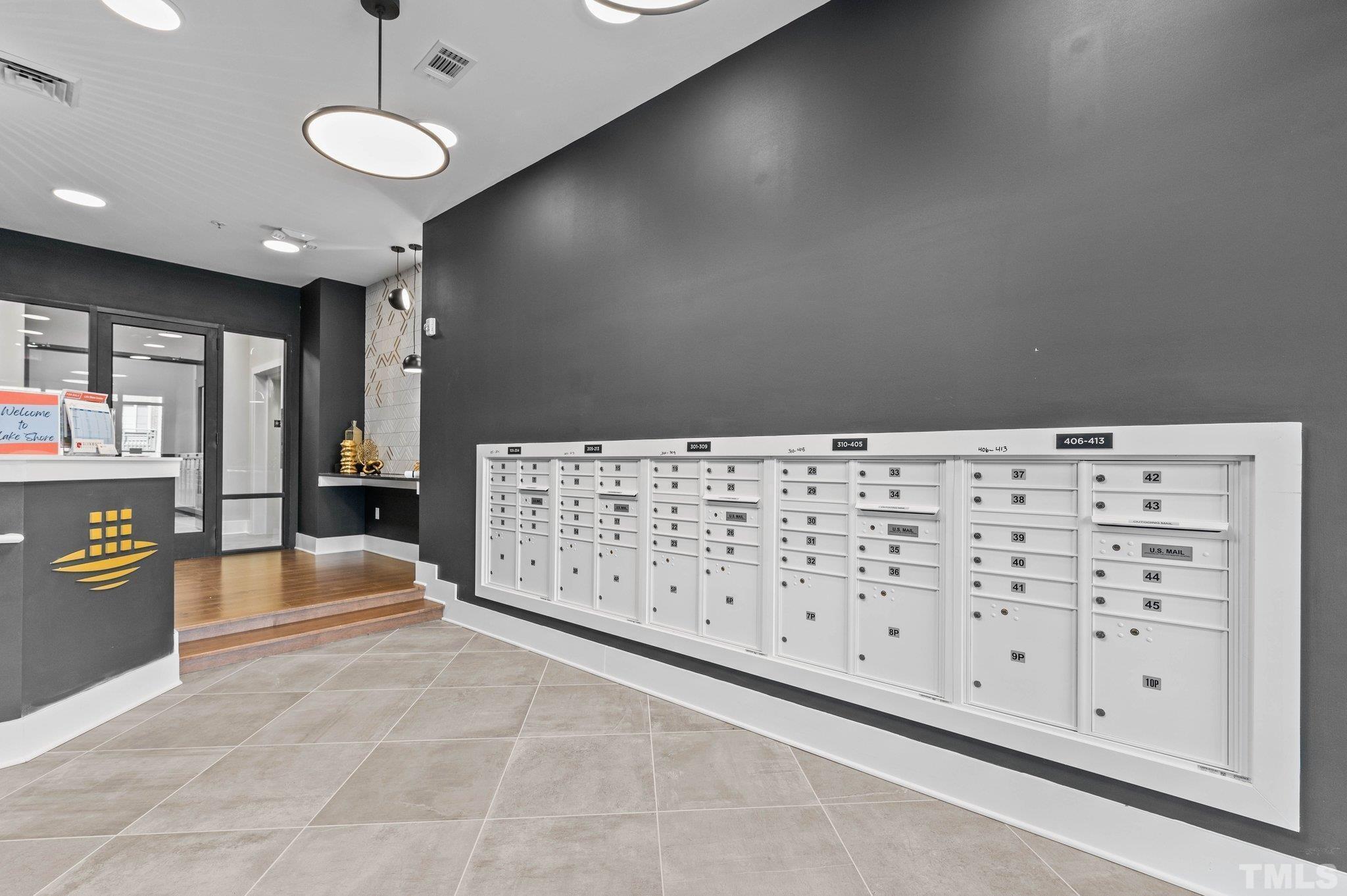 2441 Campus Shore Drive, Unit 309 Raleigh, NC 27606 - Photo 25 of 49 a large space with lots of wooden cabinets