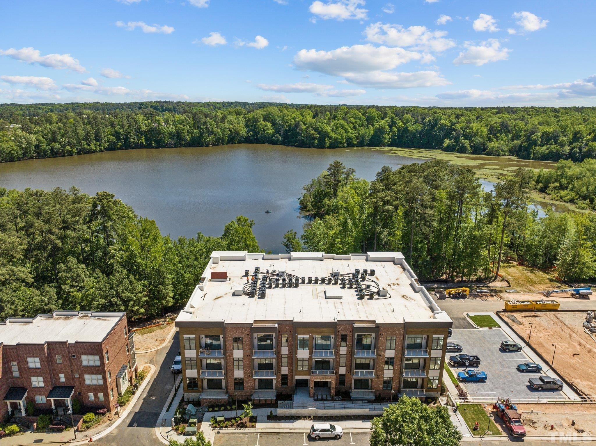 2441 Campus Shore Drive, Unit 309 Raleigh, NC 27606 - Photo 27 of 49 a view of a water with city from the terrace
