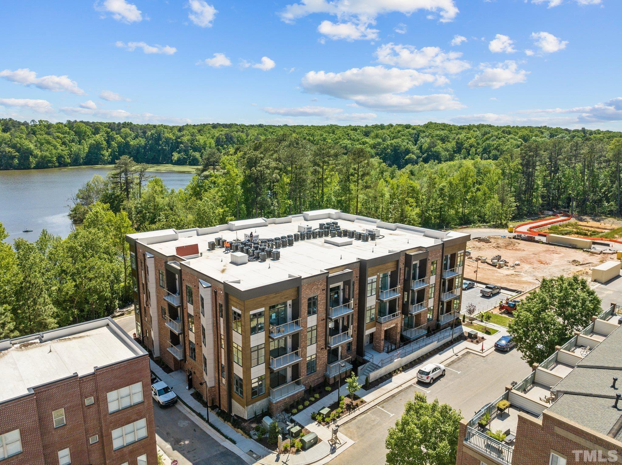 2441 Campus Shore Drive, Unit 309 Raleigh, NC 27606 - Photo 28 of 49 a view of a terrace with a lake view