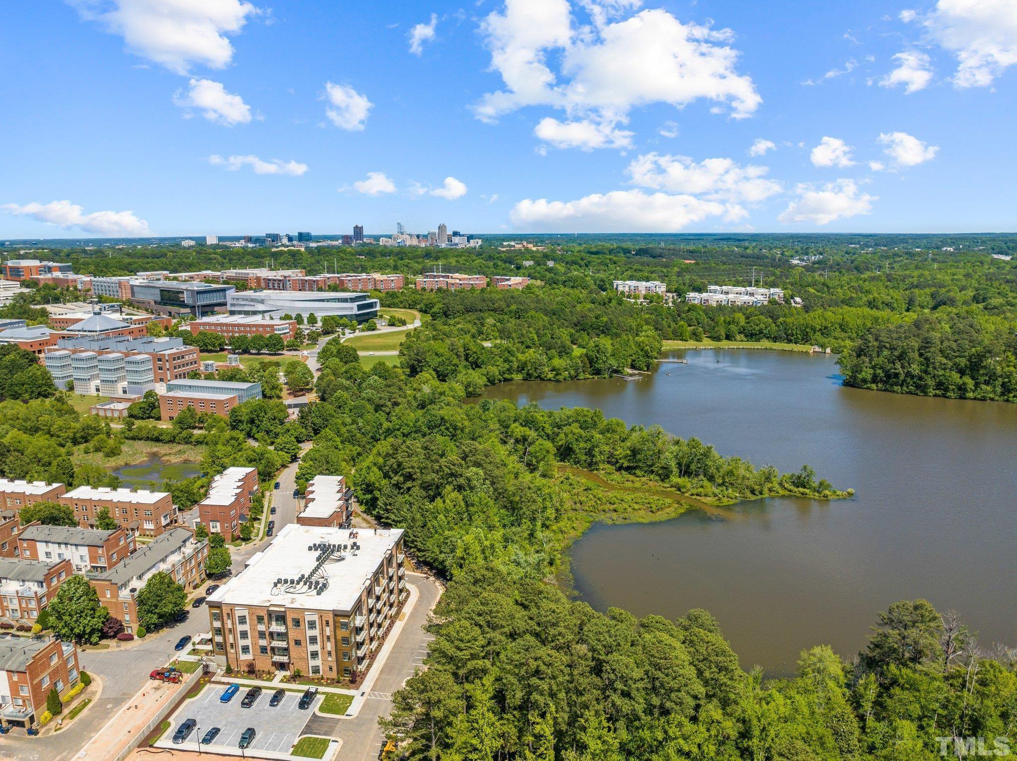 2441 Campus Shore Drive, Unit 309 Raleigh, NC 27606 - Photo 32 of 49 an aerial view of a houses with lake view