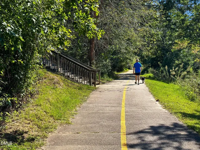 a view of a lake with houses in the back