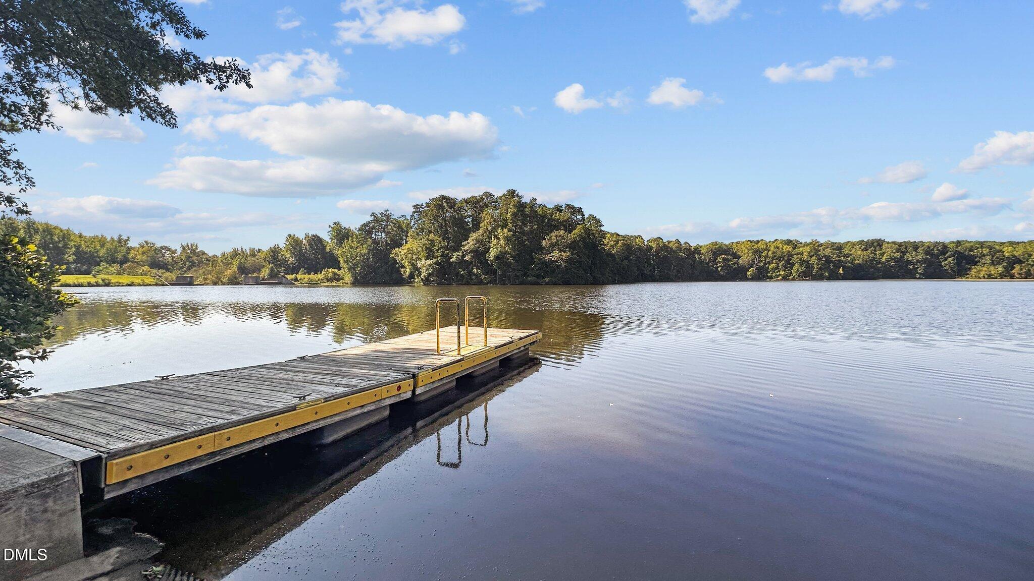 2441 Campus Shore Drive, Unit 309 Raleigh, NC 27606 - Photo 36 of 49 a view of a lake with houses in the back