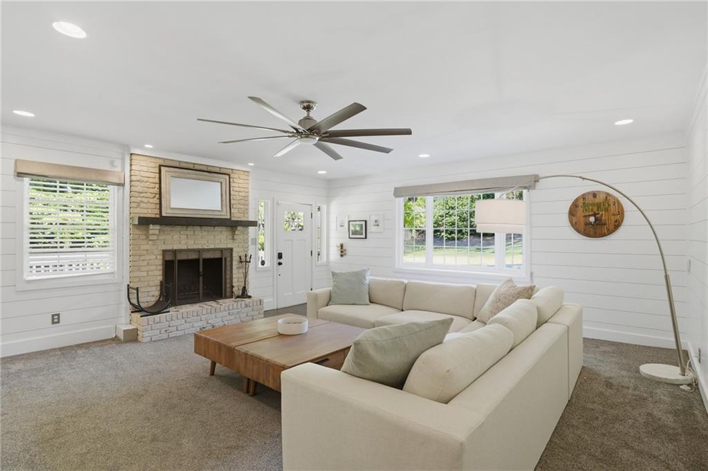 4000 Lower Roswell Road Marietta, GA 30068 - Photo 5 of 25 a living room with furniture and a fireplace