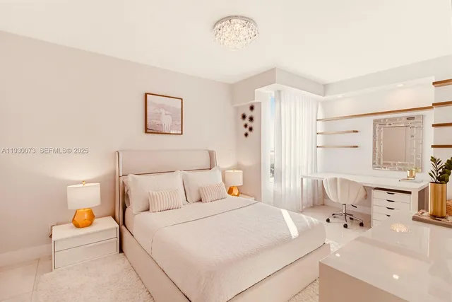 a bedroom with a bed and a table with lamp