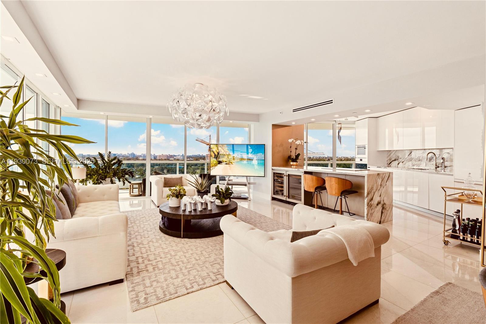 2127 Brickell Avenue, Unit 1505 Miami, FL 33129 - Photo 2 of 37 a living room with furniture kitchen view and a large window