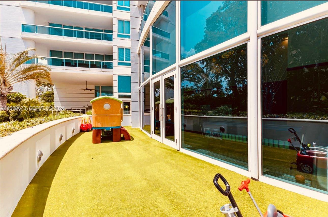 2127 Brickell Avenue, Unit 1505 Miami, FL 33129 - Photo 23 of 37 a view of a swimming pool with a patio and yard from the balcony