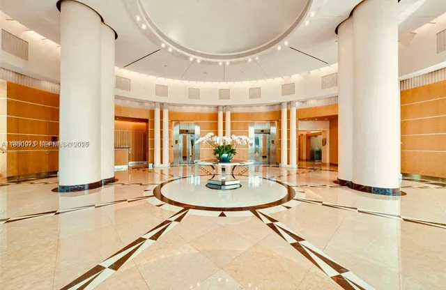 a dining room with large window a table and chairs