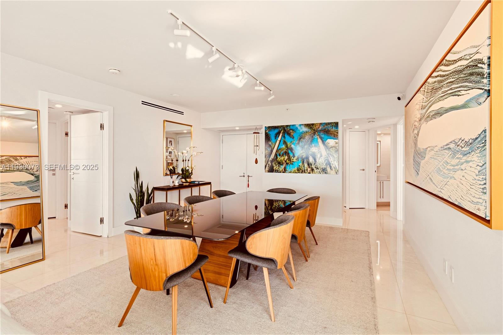 2127 Brickell Avenue, Unit 1505 Miami, FL 33129 - Photo 4 of 37 a view of a dining room with furniture one side kitchen view and wooden floor