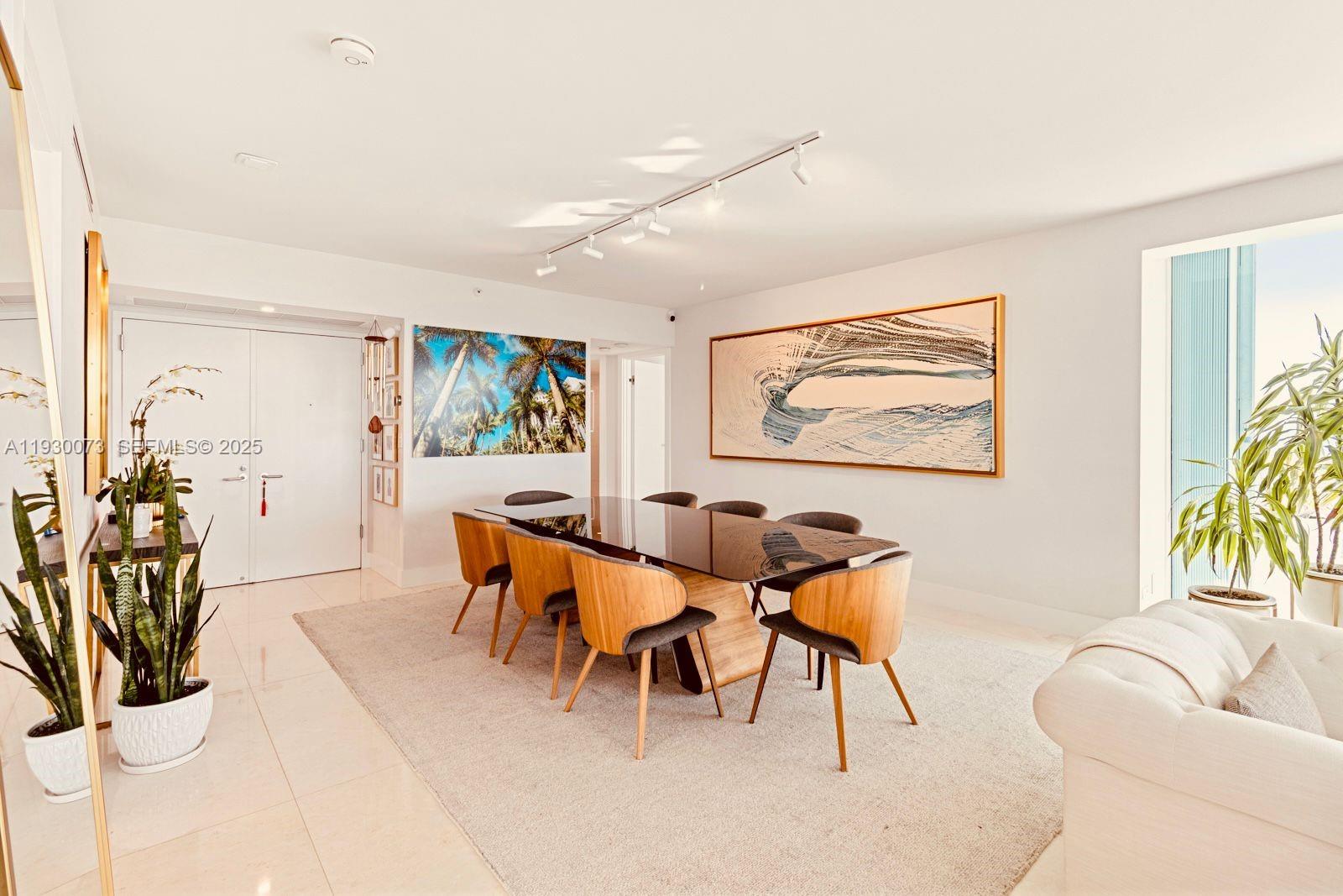 2127 Brickell Avenue, Unit 1505 Miami, FL 33129 - Photo 6 of 37 a dining room with furniture and a potted plant