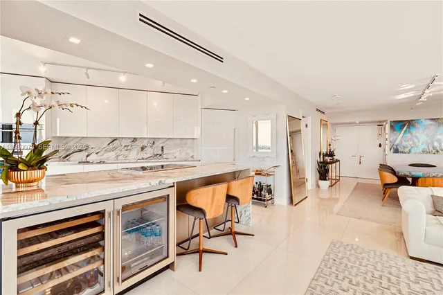 a kitchen with stainless steel appliances granite countertop a sink and cabinets
