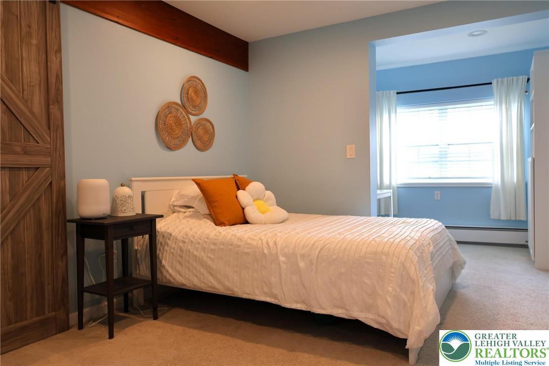 8297 Mertztown Road Lower Macungie Township, PA 18011 - Photo 13 of 22 a bedroom with a bed and a window