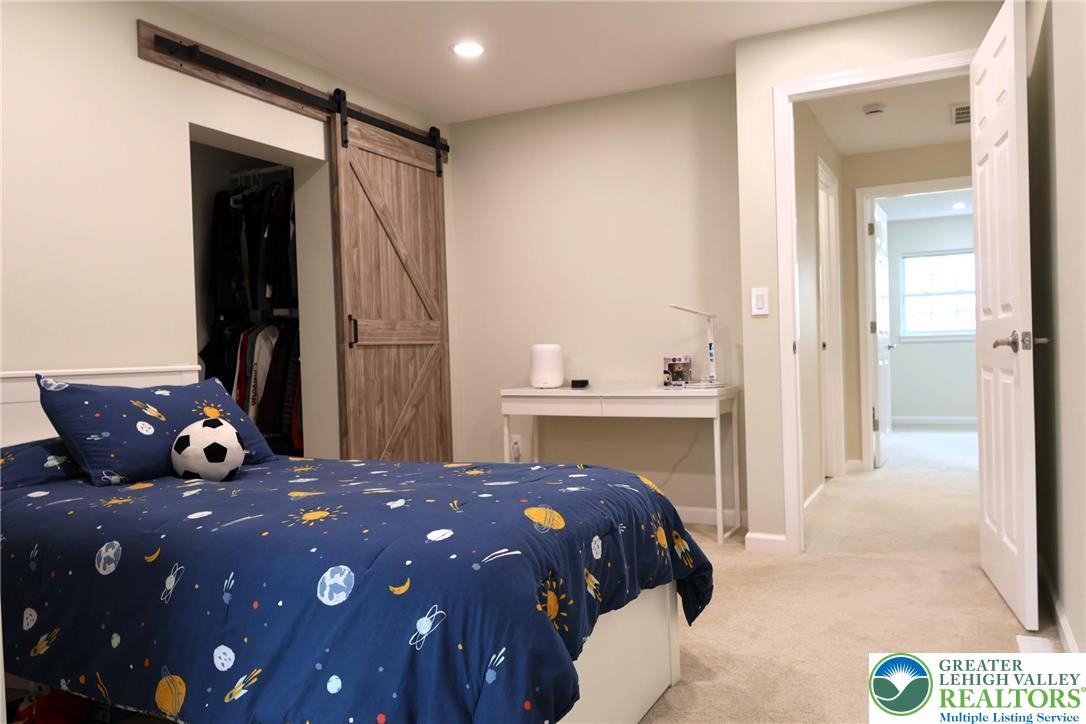 8297 Mertztown Road Lower Macungie Township, PA 18011 - Photo 15 of 22 a bedroom with a bed and a mirror