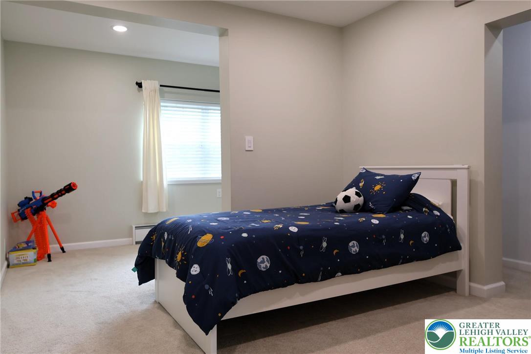 8297 Mertztown Road Lower Macungie Township, PA 18011 - Photo 16 of 22 a bedroom with a bed and a window