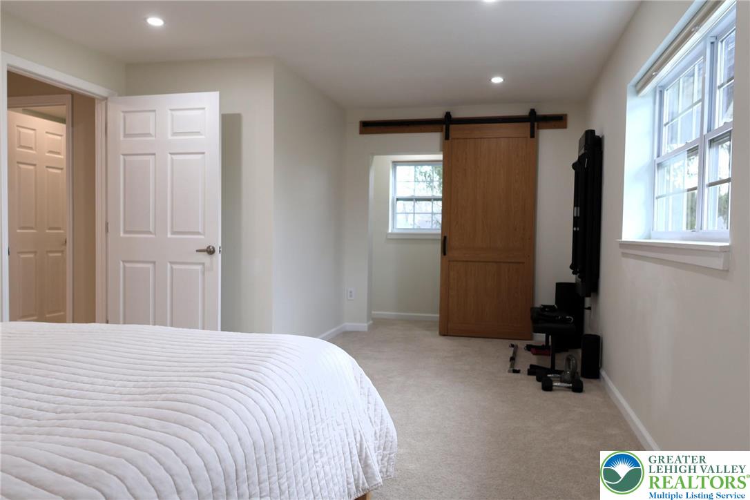 8297 Mertztown Road Lower Macungie Township, PA 18011 - Photo 18 of 22 a bedroom with a bed and a window