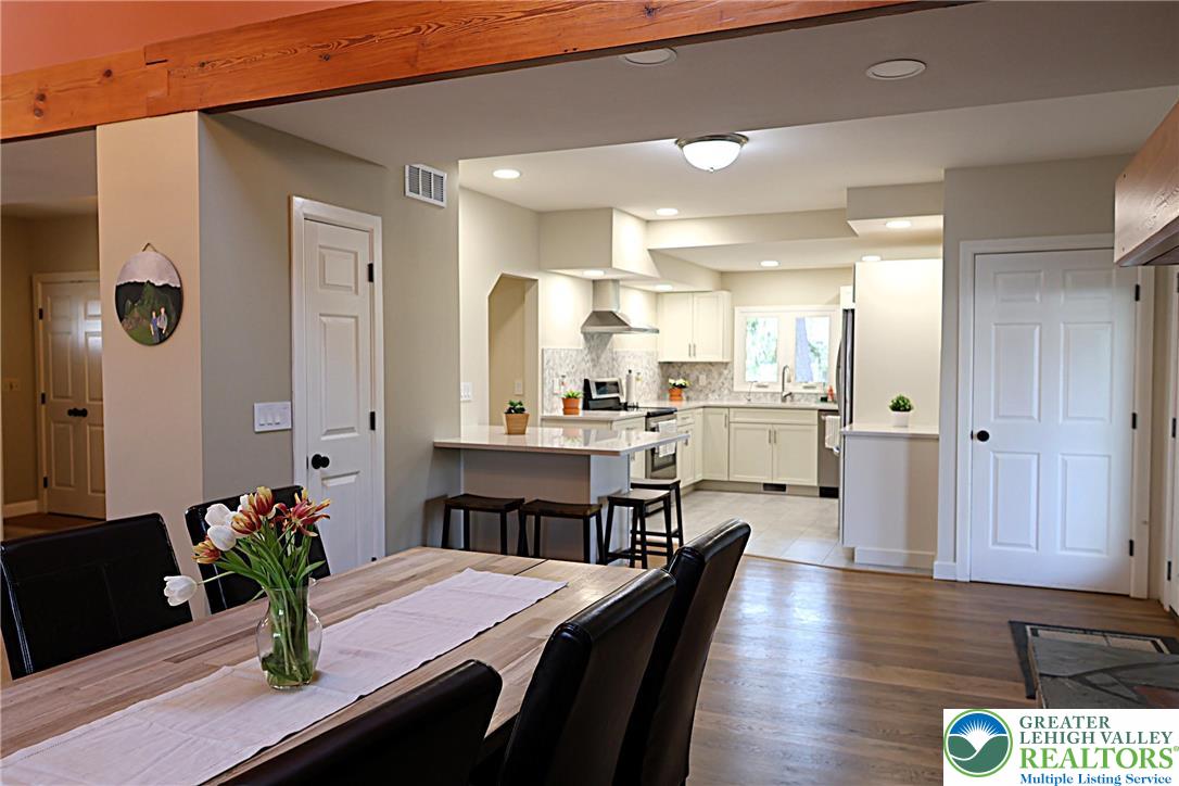 8297 Mertztown Road Lower Macungie Township, PA 18011 - Photo 5 of 22 a kitchen with a table and chairs in it