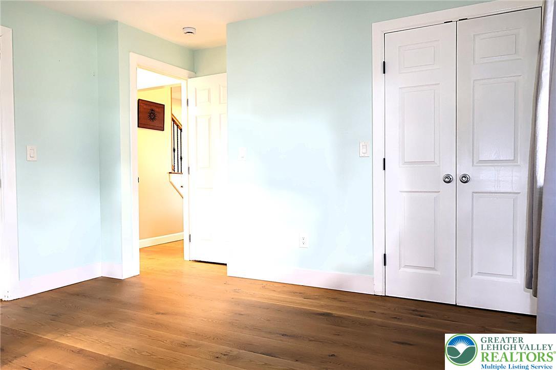 8297 Mertztown Road Lower Macungie Township, PA 18011 - Photo 10 of 22 a view of hallway with wooden floor