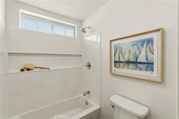 a bathroom with a shower and a toilet