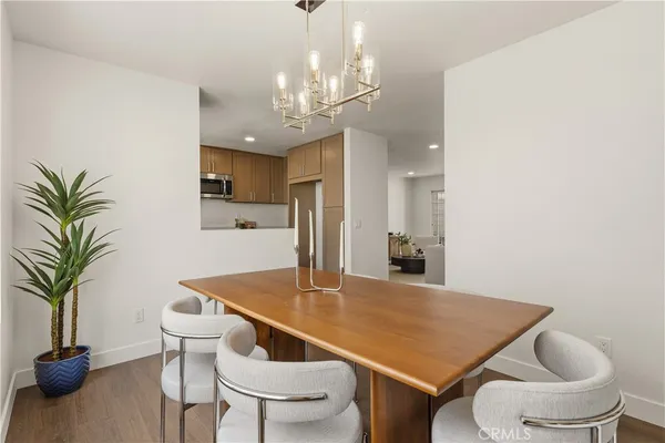 a kitchen with a table and chairs in it