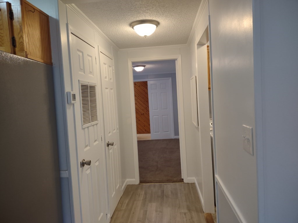 81 Rabbit Road Salisbury, MA 01952 - Photo 11 of 21 a view of a hallway with wooden floor