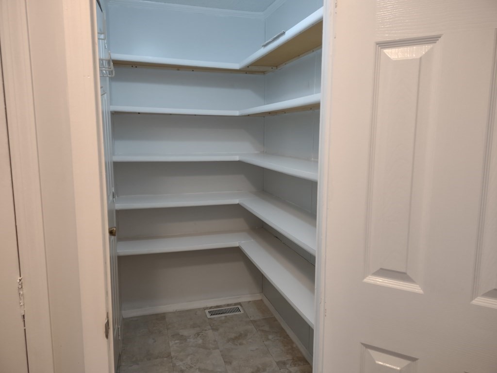 81 Rabbit Road Salisbury, MA 01952 - Photo 14 of 21 a view of walk in closet with empty racks