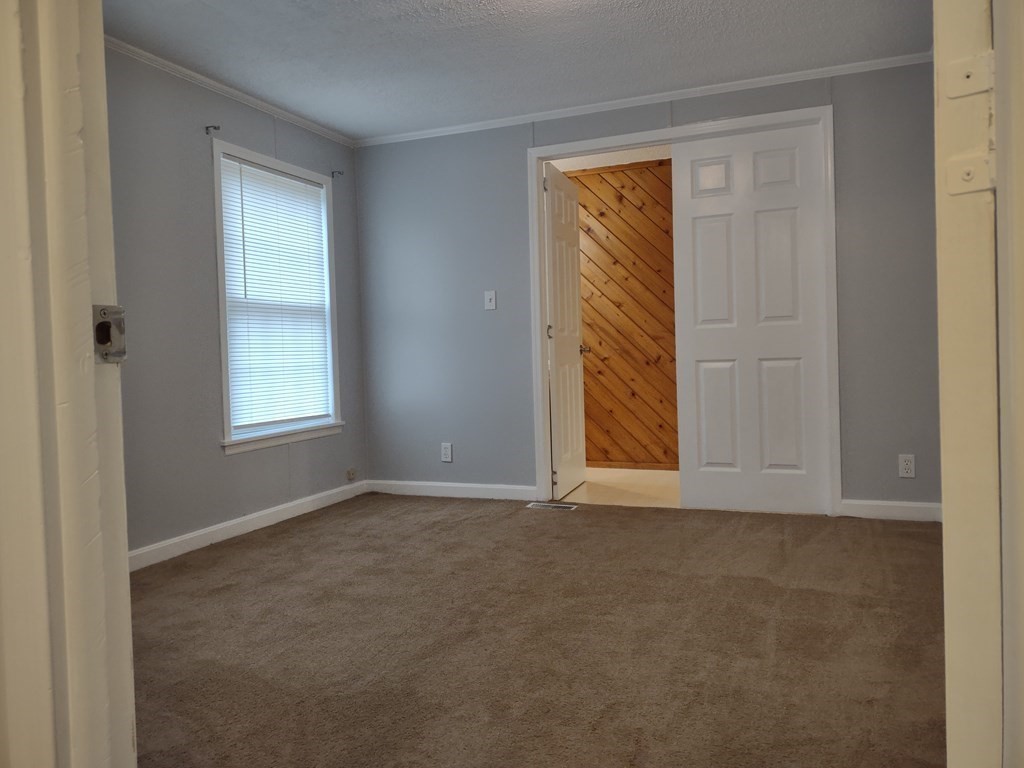 81 Rabbit Road Salisbury, MA 01952 - Photo 15 of 21 a view of an empty room with window and closet area