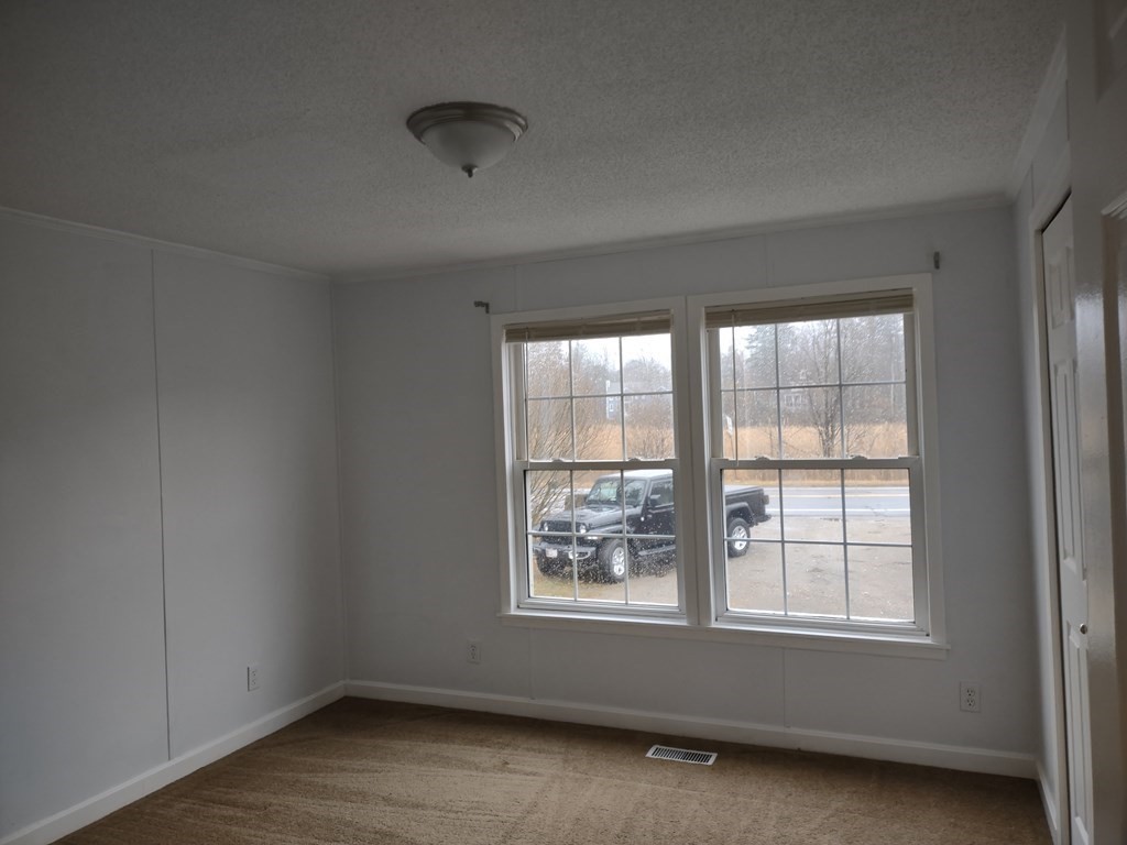 81 Rabbit Road Salisbury, MA 01952 - Photo 4 of 21 an empty room with a window