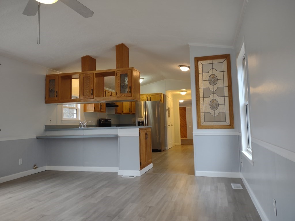 81 Rabbit Road Salisbury, MA 01952 - Photo 8 of 21 a kitchen with a refrigerator and a sink