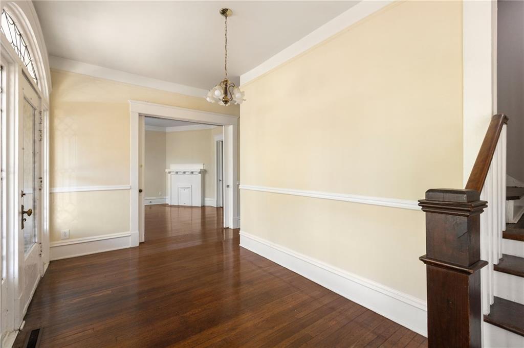 120 South Candler Street Decatur, GA 30030 - Photo 9 of 40 a view of a kitchen with a refrigerator and wooden floor