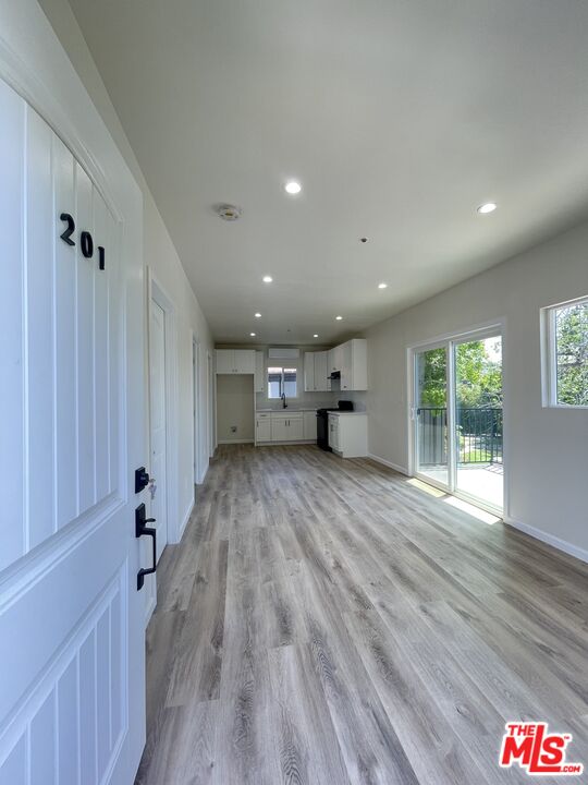280 Grandview Street Pasadena, CA 91104 - Photo 19 of 34 a view of empty room with wooden floor and windows
