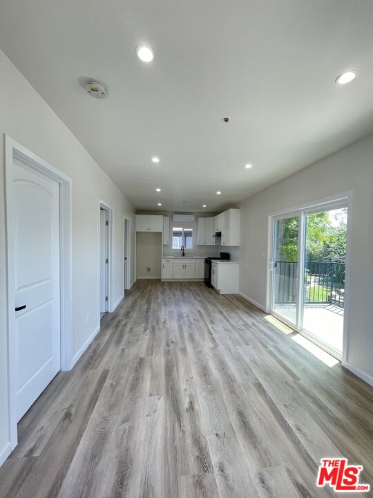280 Grandview Street Pasadena, CA 91104 - Photo 20 of 34 a view of empty room with wooden floor and window