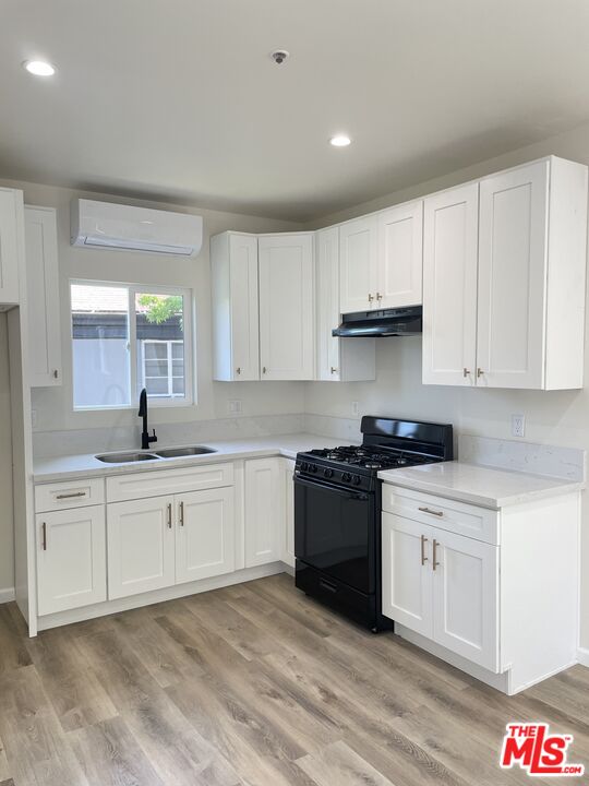 280 Grandview Street Pasadena, CA 91104 - Photo 23 of 34 a kitchen with granite countertop white cabinets and stainless steel appliances